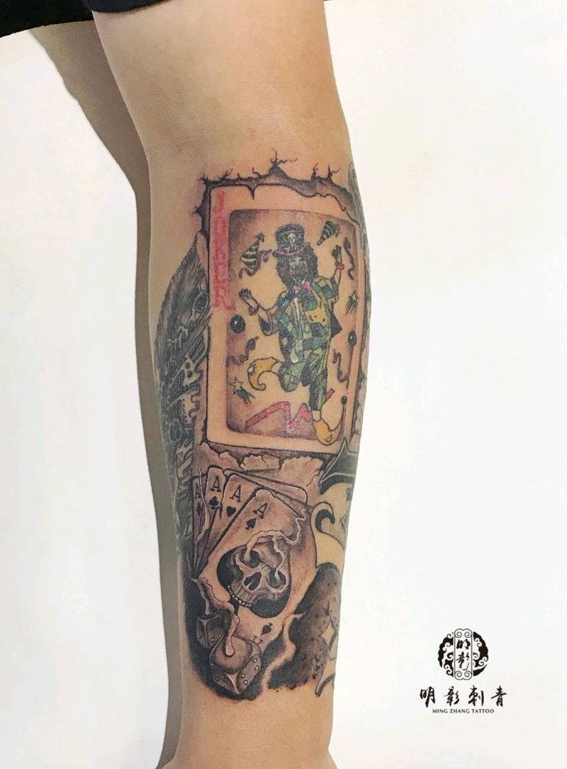 扑克牌窟窿纹身图片_手臂欧美写实纹身图案