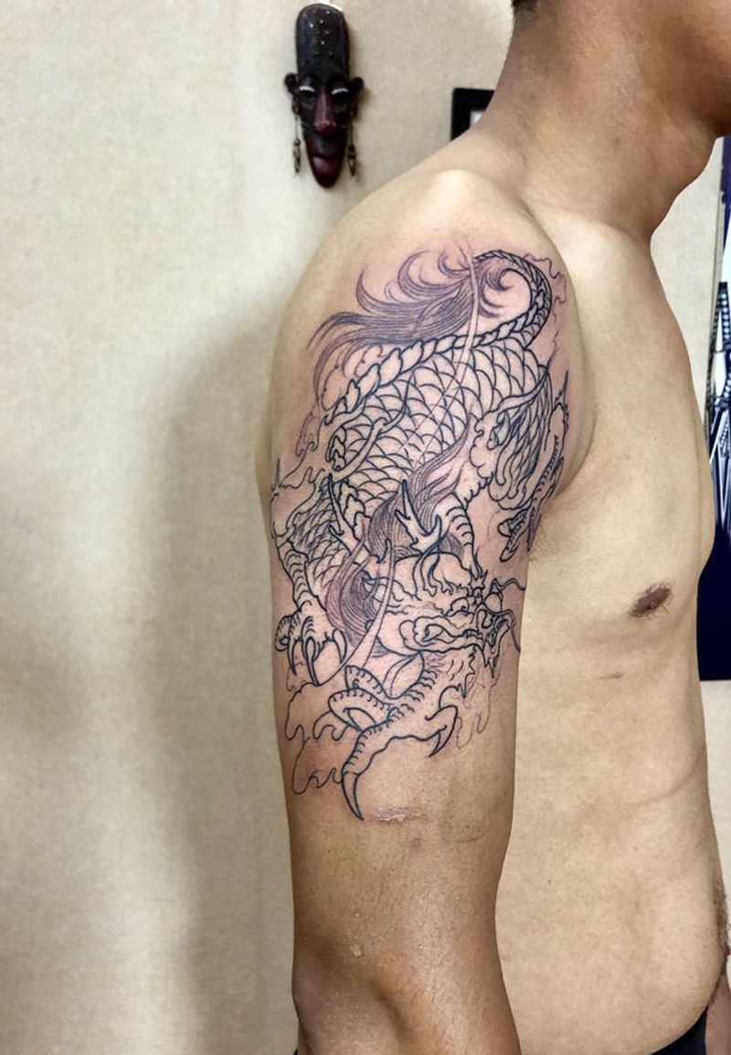 麒麟纹身图片_手臂新传统线条大臂麒麟纹身图案