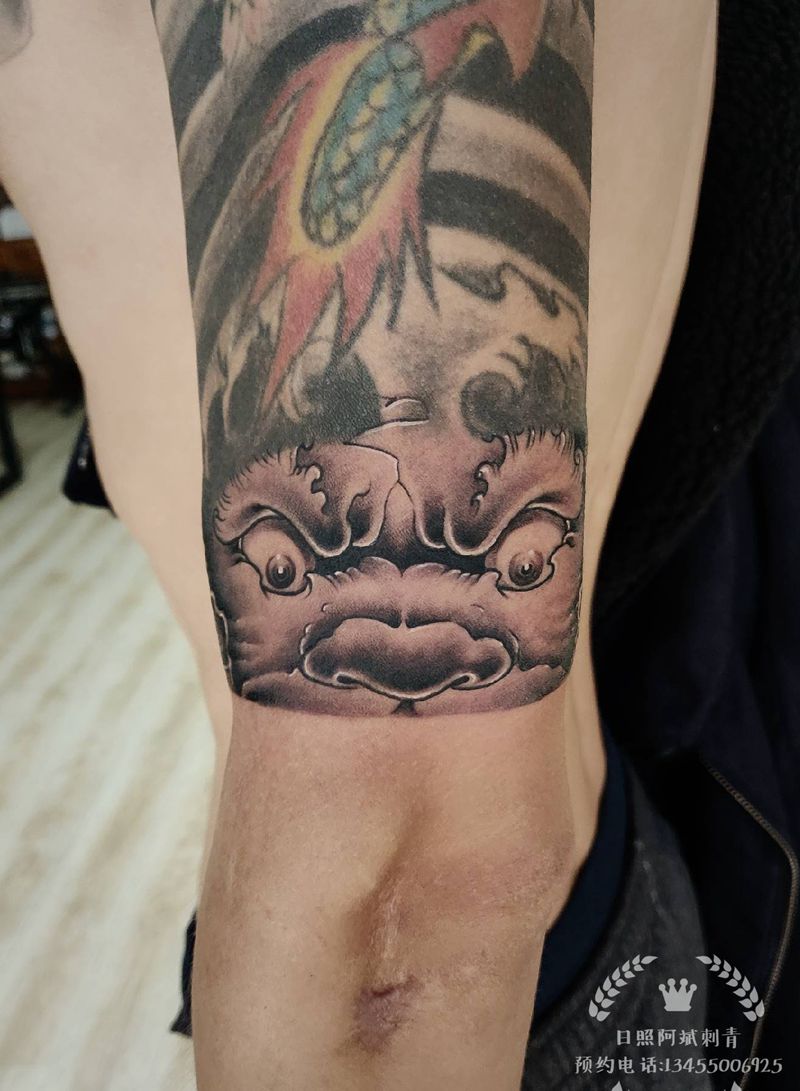 福狮纹身图片_手臂新传统纹身图案