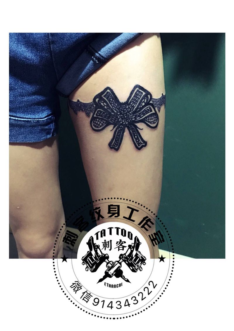 蝴蝶结纹身图片_腿部纹身图案