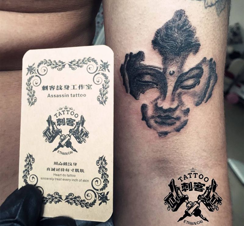 佛头点刺纹身图片