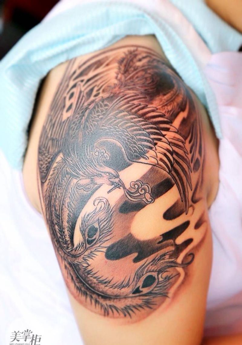 大臂凤凰纹身图片_传统动物手臂纹身图案