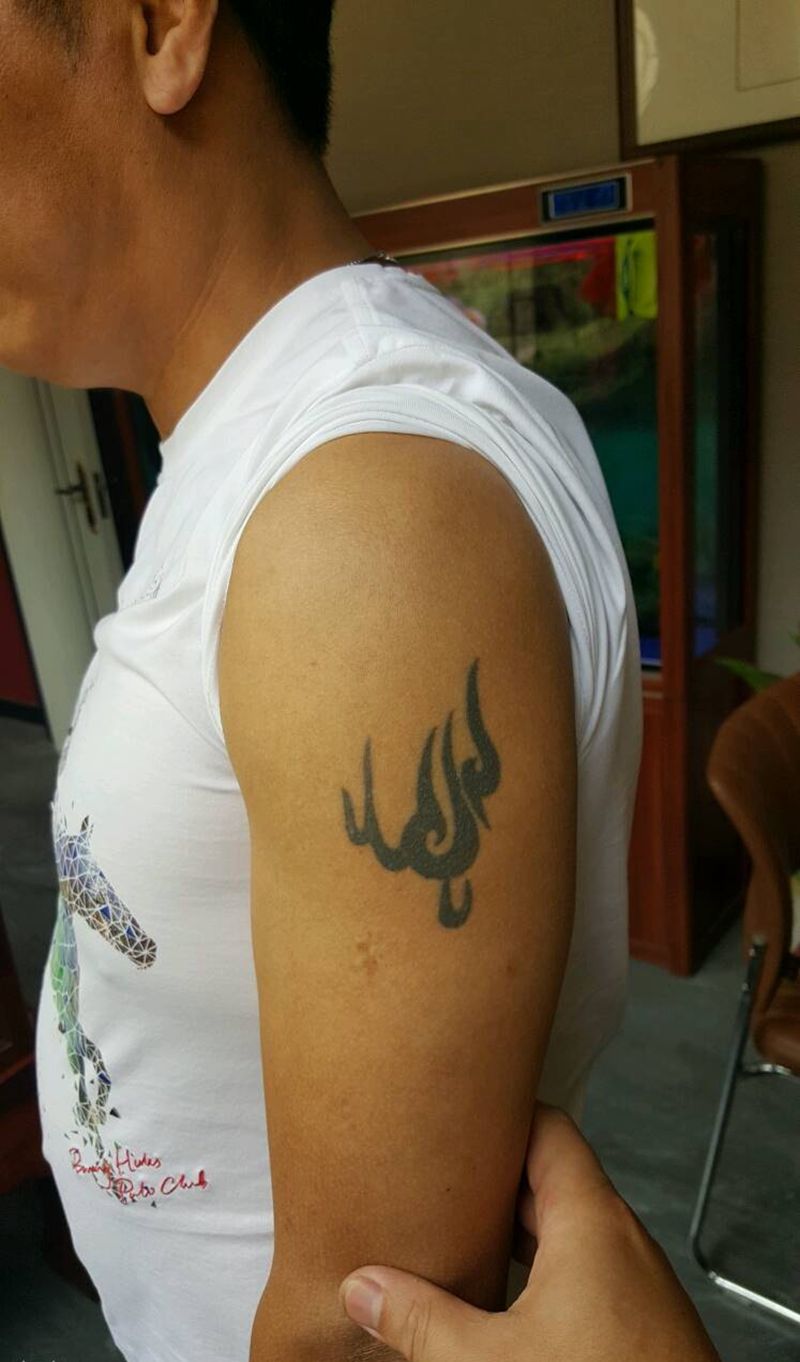 覆盖图腾纹身图片_手臂传统鬼神宗教聊城烈火风格烈火堂成品纹身图案