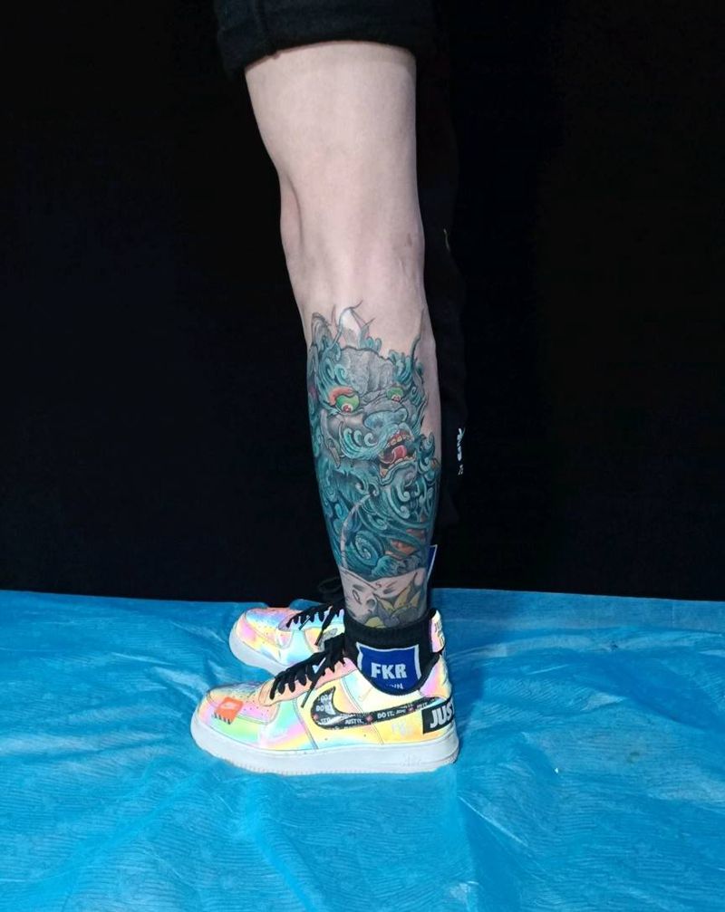 唐狮覆盖纹身图片_腿部纹身图案