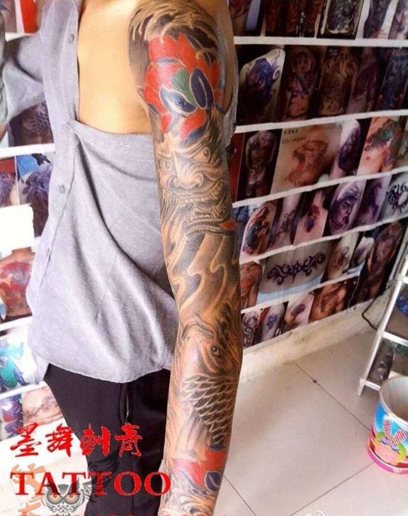 花臂班诺鱼纹身图片_鬼神原创传统手臂成品纹身图案