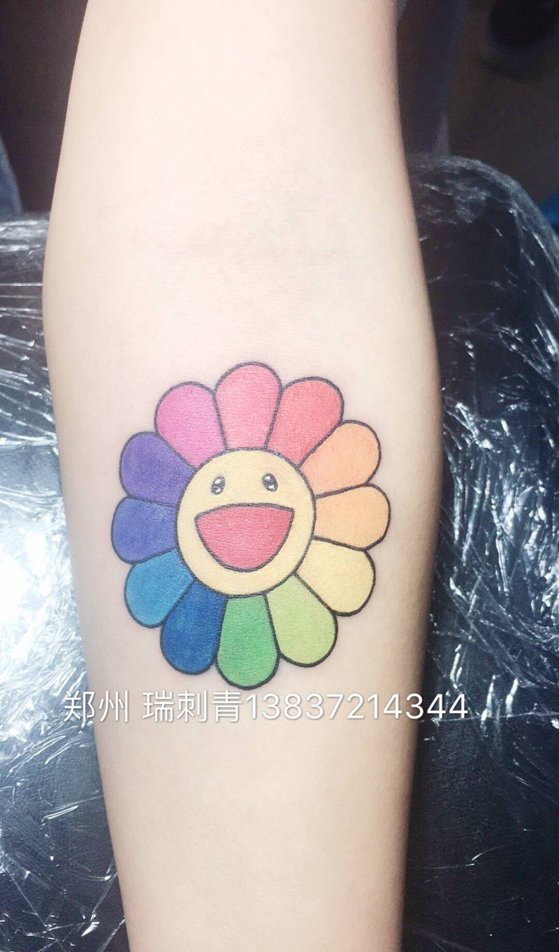 太阳花纹身图片_手臂纹身图案