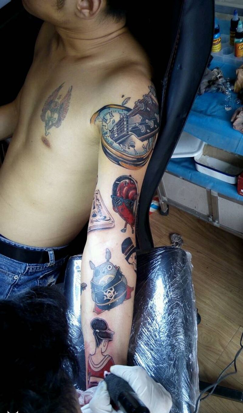 拼图花臂工作花絮纹身图片_手臂欧美动物人物植物成品纹身图案