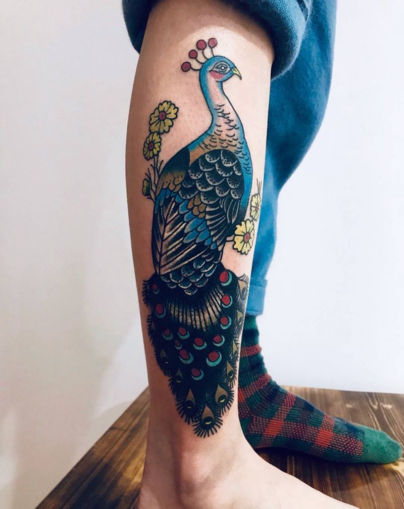 小腿孔雀遮盖旧纹身完成纹身图片