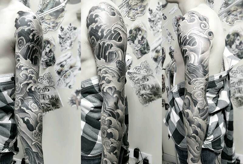 浪花包花臂纹身图片