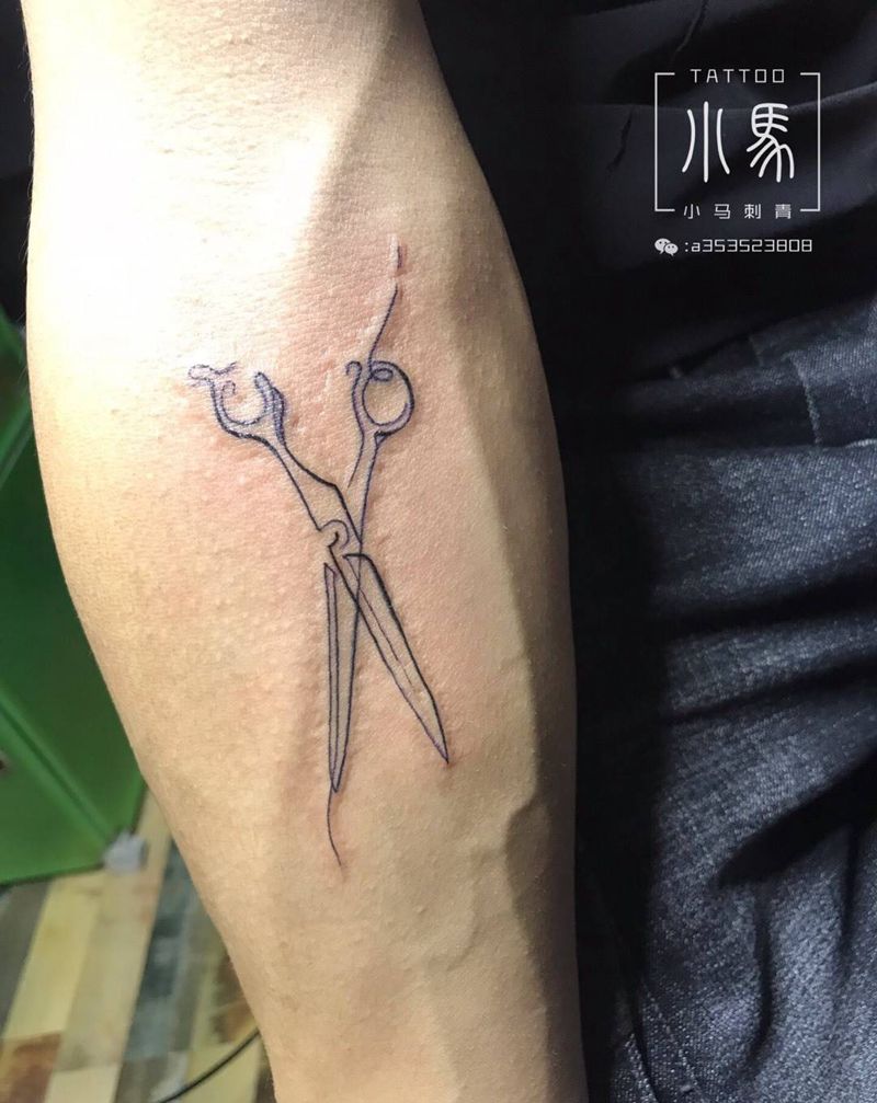 美发师。纹身图片_手臂纹身图案