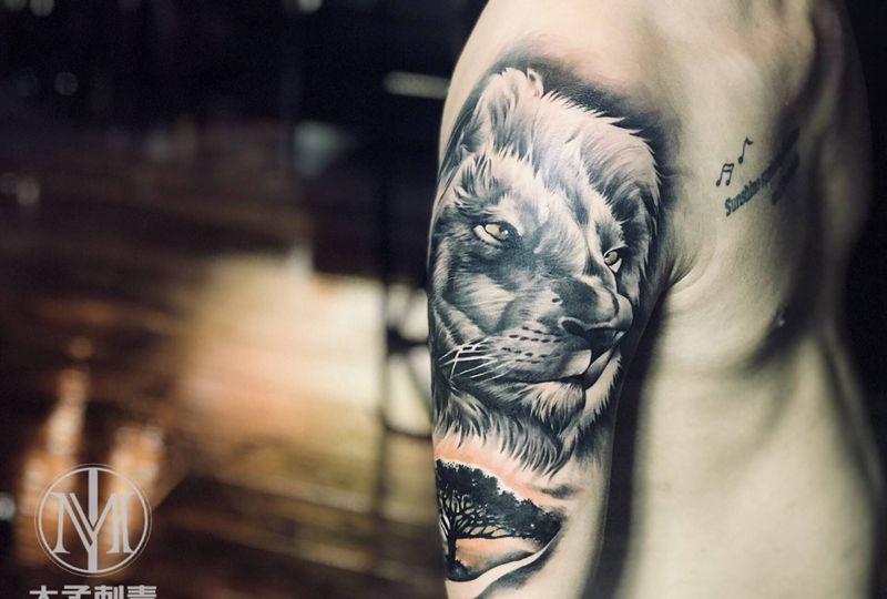 狮子纹身图片_手臂欧美写实纹身图案