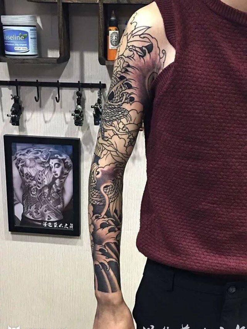 花臂未完待续纹身图片