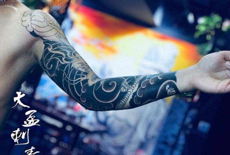 老传统花臂未完待续纹身图片_手臂纹身图案