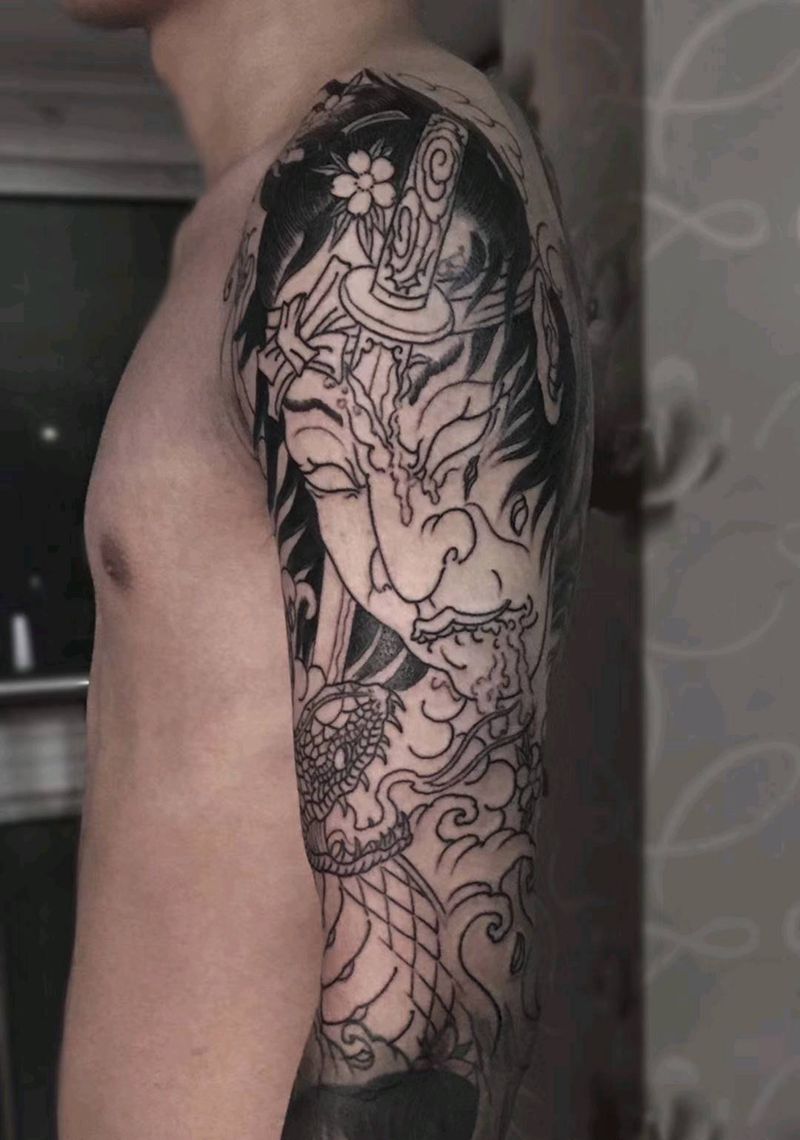 生首与蛇纹身图片_手臂纹身图案