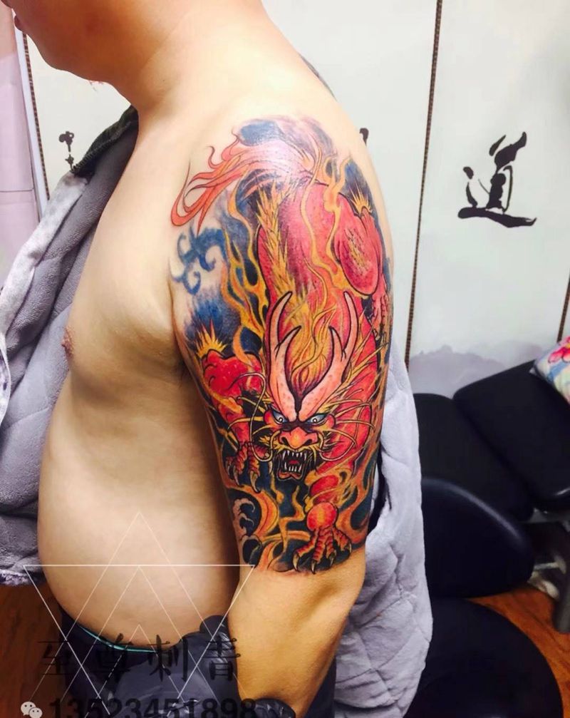烈火麒麟纹身图片_手臂新传统纹身图案