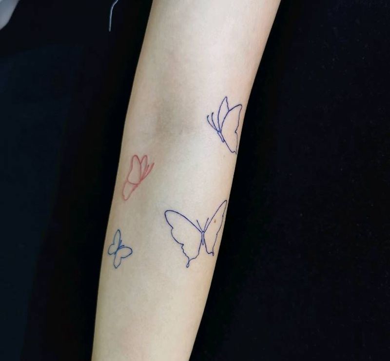 蝴蝶纹身图片_手臂几何图腾蝴蝶纹身图案