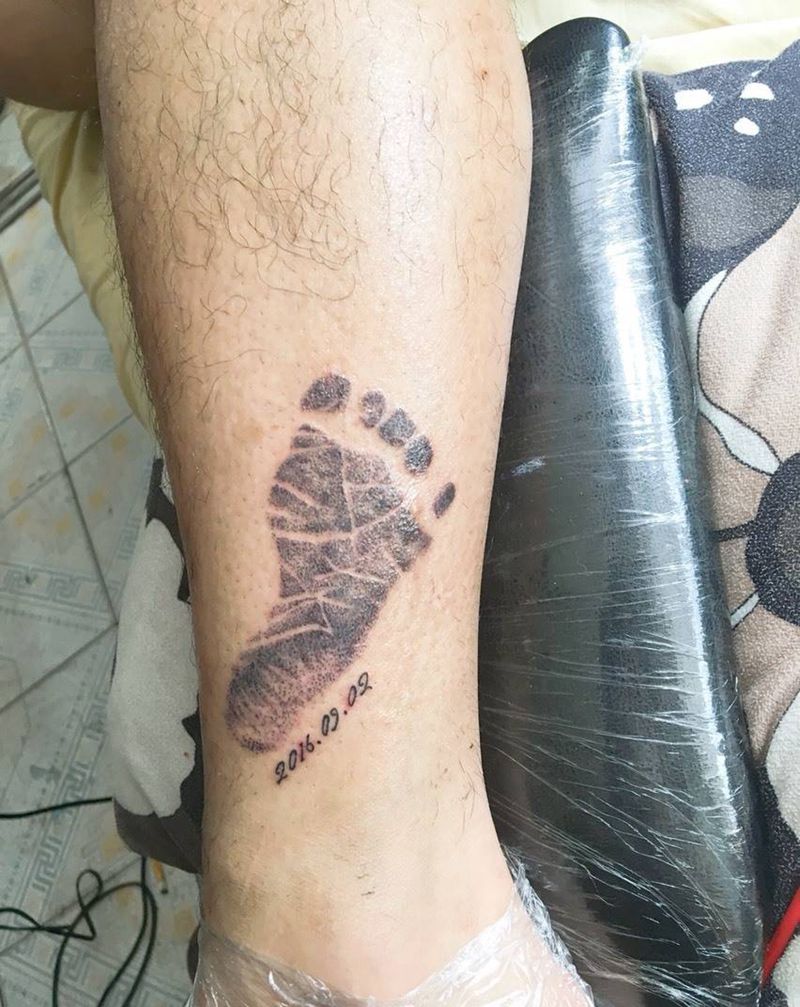 儿子的脚印纹身图片