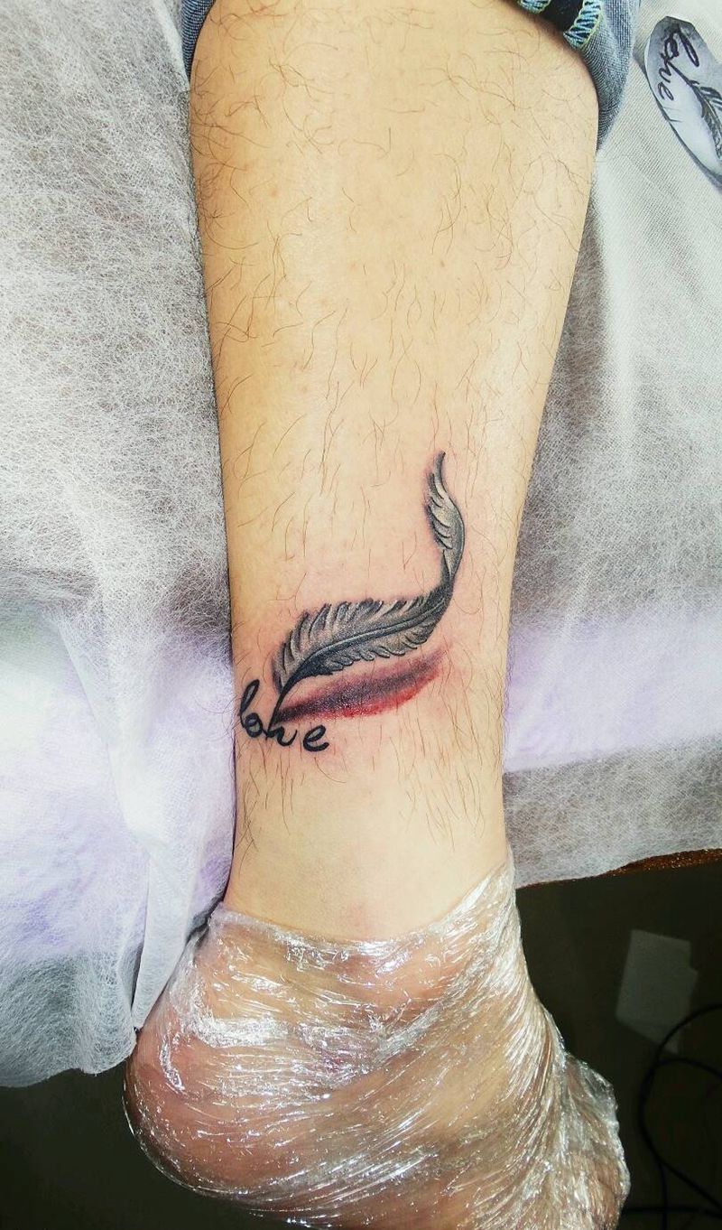 羽毛纹身图片_腿部欧美静物原创成品纹身图案