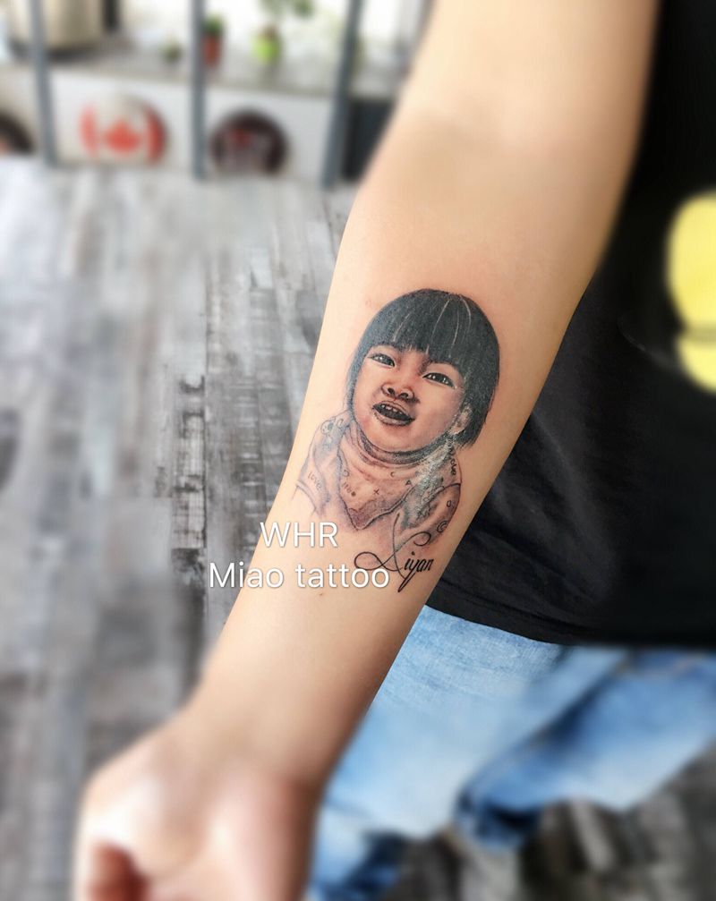 小天使纹身图片_手臂欧美写实纹身图案