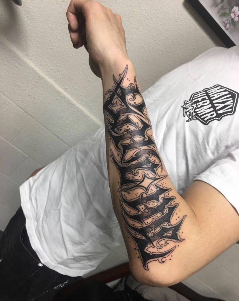 其卡诺花体纹身图片_手臂纹身图案