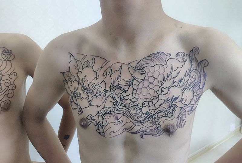 唐狮纹身图片_胸部新传统纹身图案