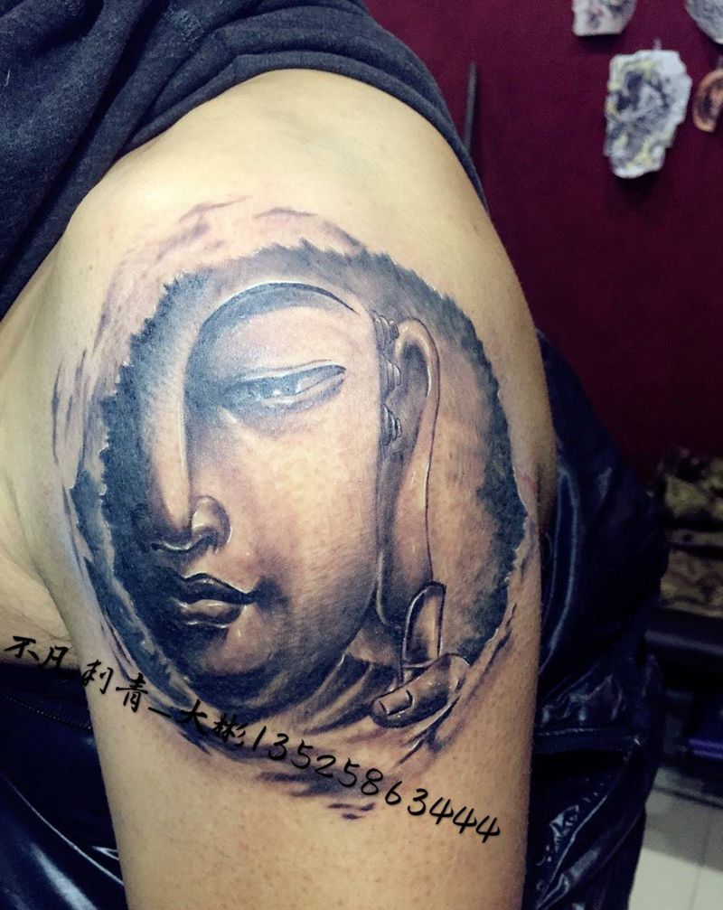 半面佛纹身图片