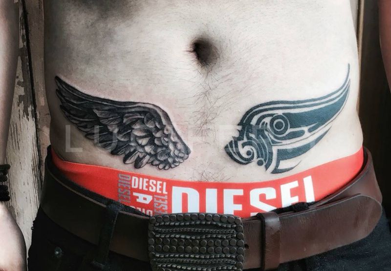 小腹翅膀纹身图片_成品腹部欧美写实图腾动物纹身图案