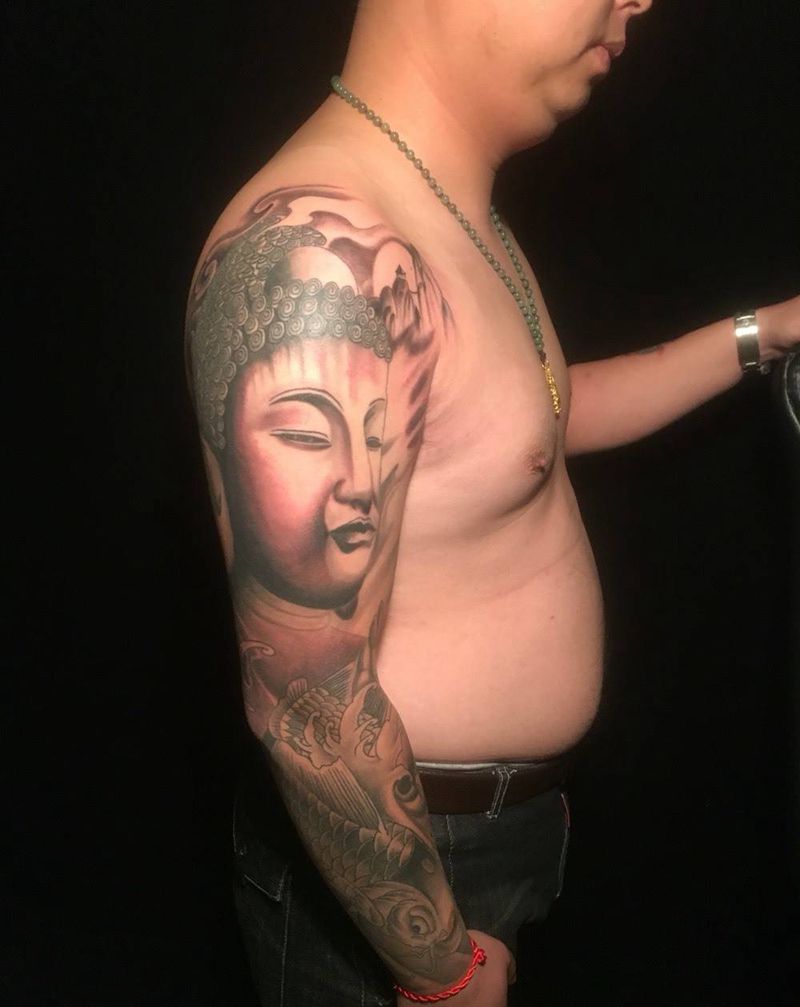 佛头花臂纹身图片