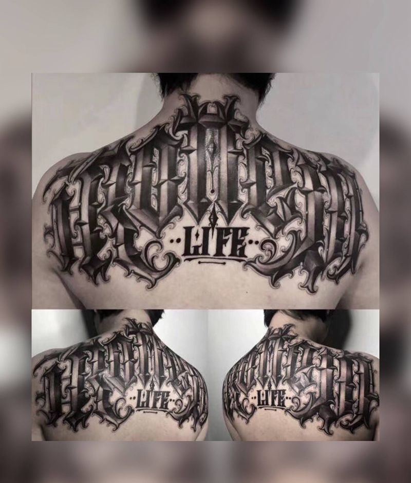 UVB2纹身图片_背部肩部花体字纹身图案