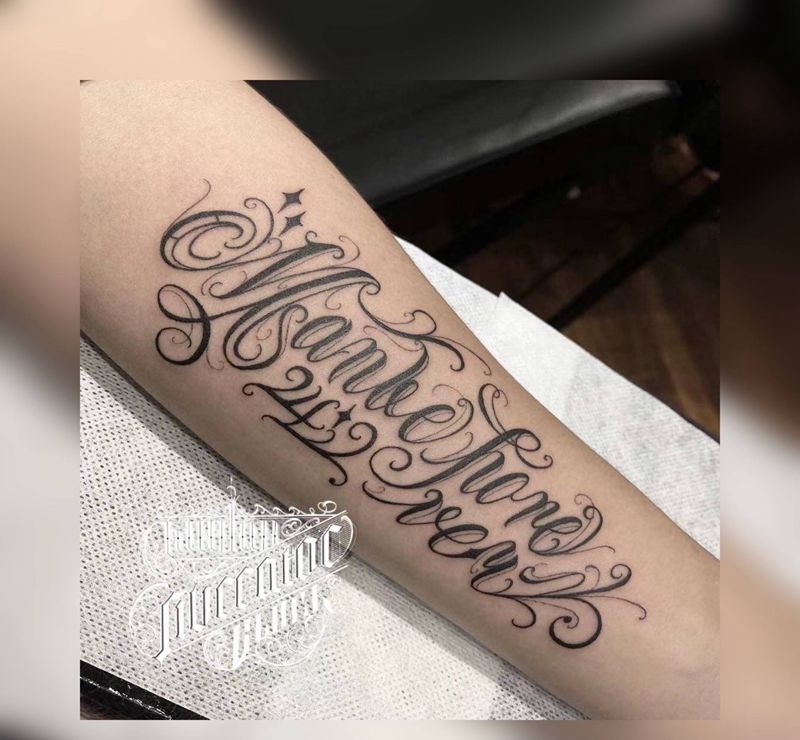 UVB2纹身图片_手臂花体字纹身图案