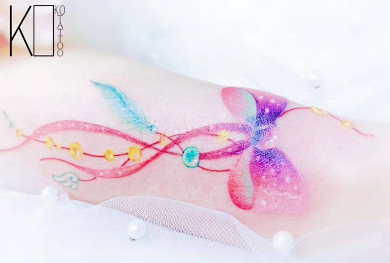 蝴蝶结纹身图片_手臂水彩一人一图遮盖设计定制设计纹身图案