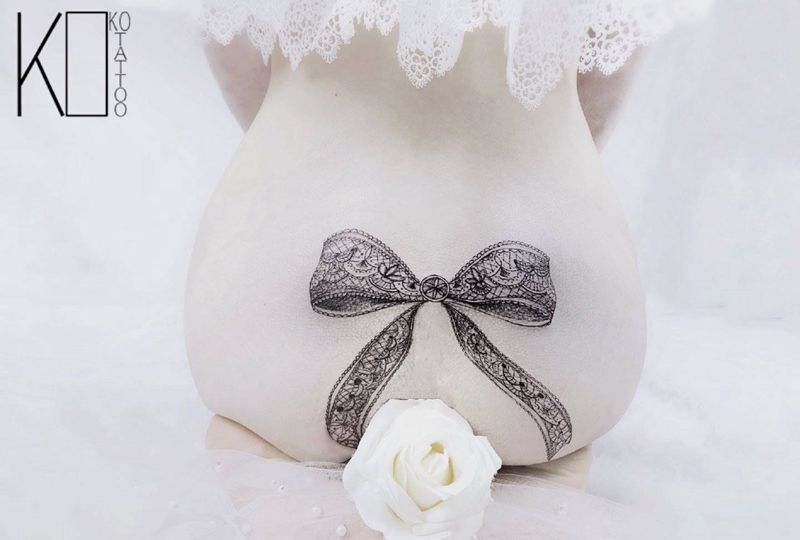 蝴蝶结纹身图片_臀部点刺伤疤遮盖性感遮盖纹身图案