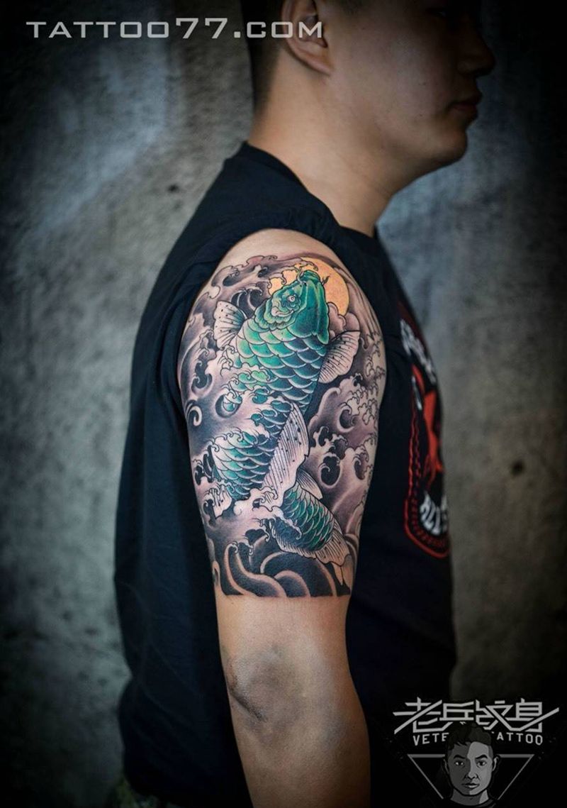 大臂传统鲤鱼纹身作品纹身图片_成品手臂传统动物纹身图案