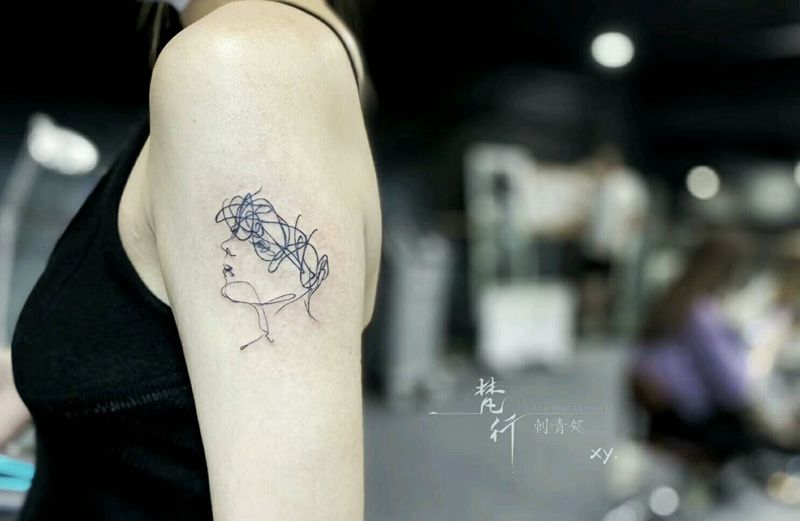 头像纹身图片_手臂几何头像纹身图案