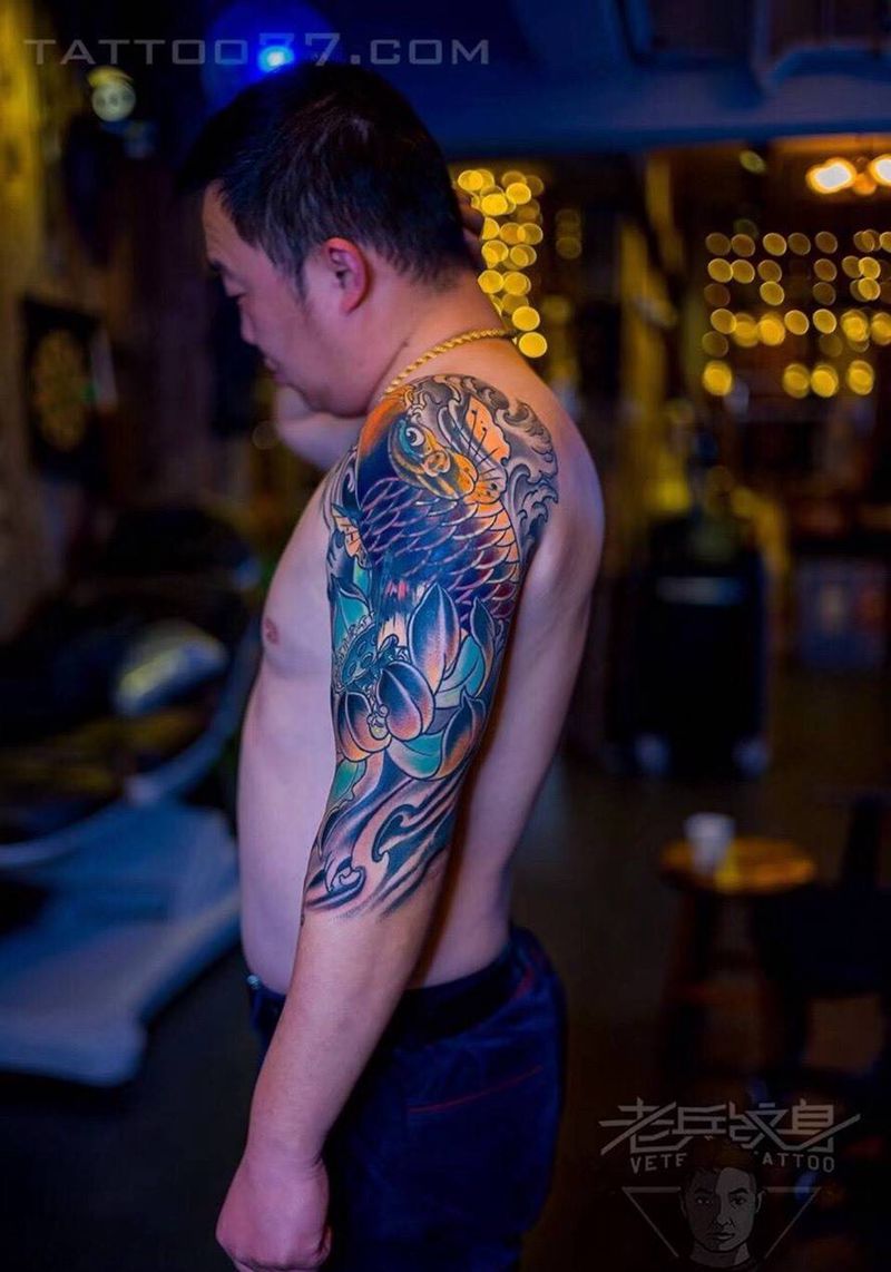大臂鲤鱼纹身作品纹身图片_成品手臂传统动物纹身图案
