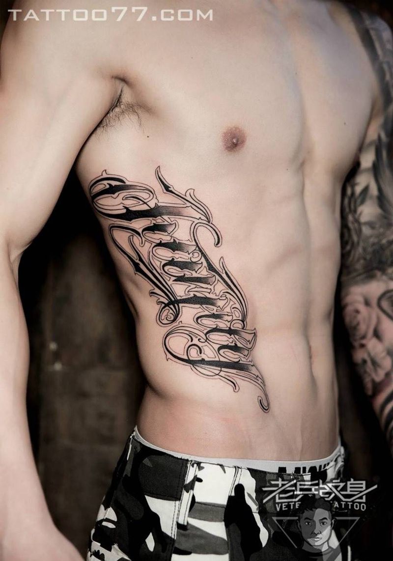 侧腰花体字纹身纹身图片