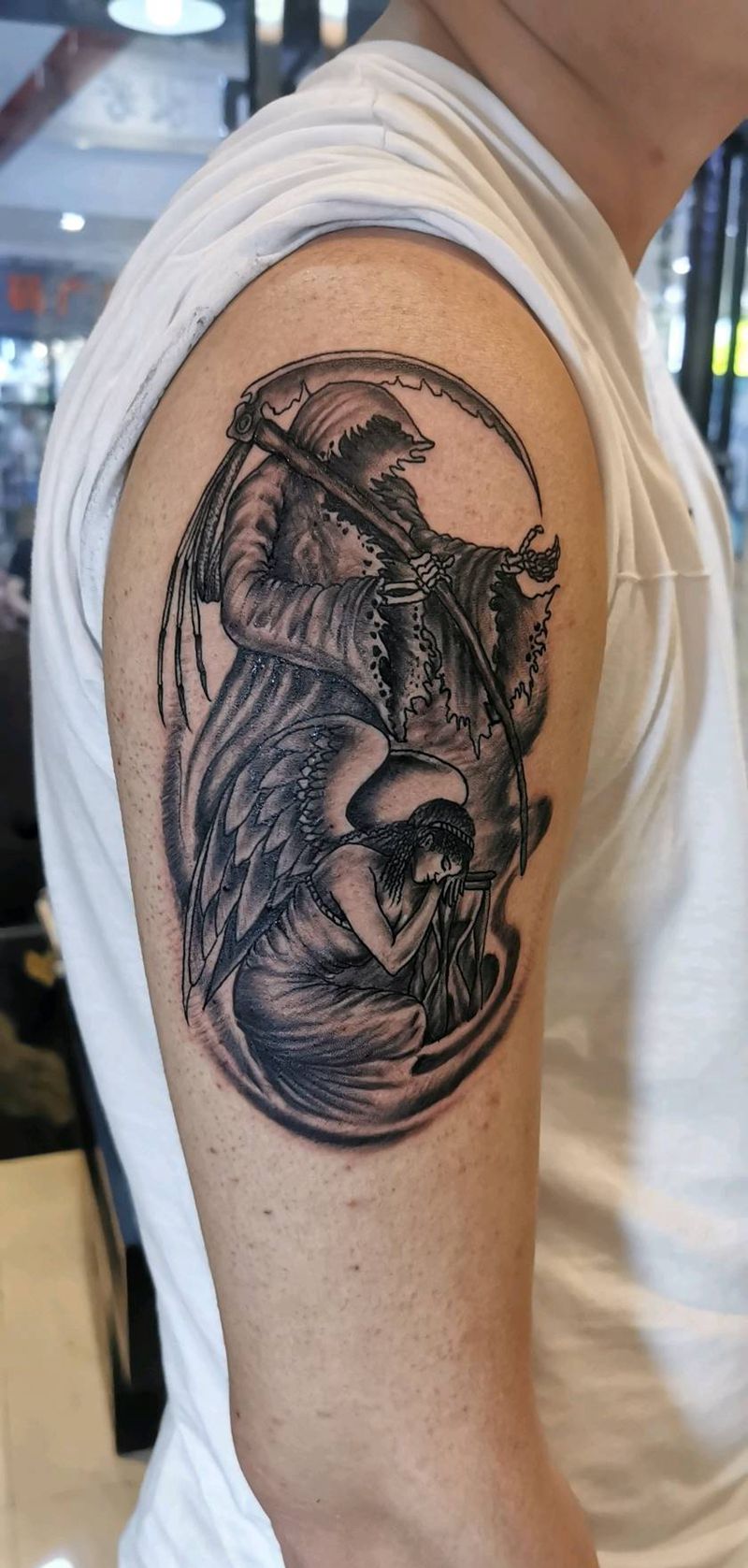 死神与天使纹身图片_手臂老传统纹身图案