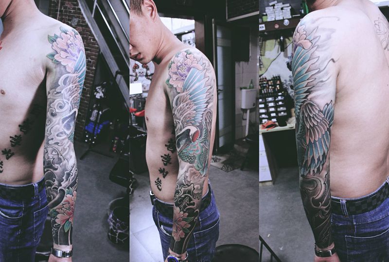 花臂鹤纹身图片_手臂新传统纹身图案