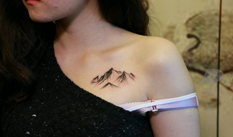 山纹身图片_胸部手臂新传统点刺山纹身图案