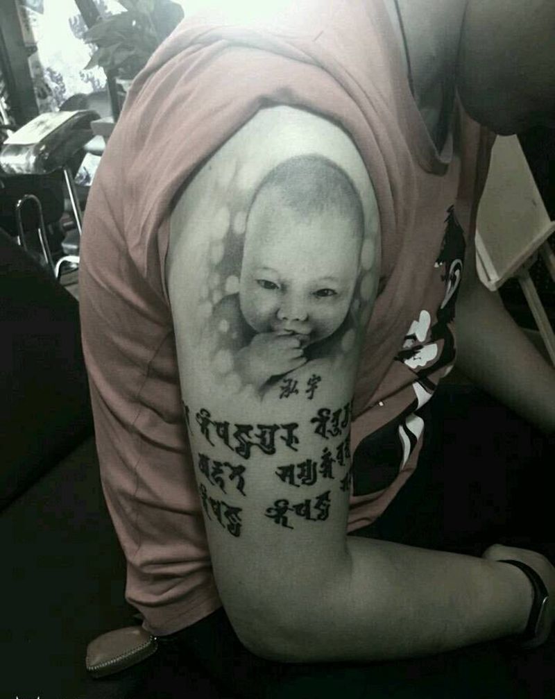 恢复后的肖像添加梵文纹身图片_手臂肖像字符人物宗教成品纹身图案