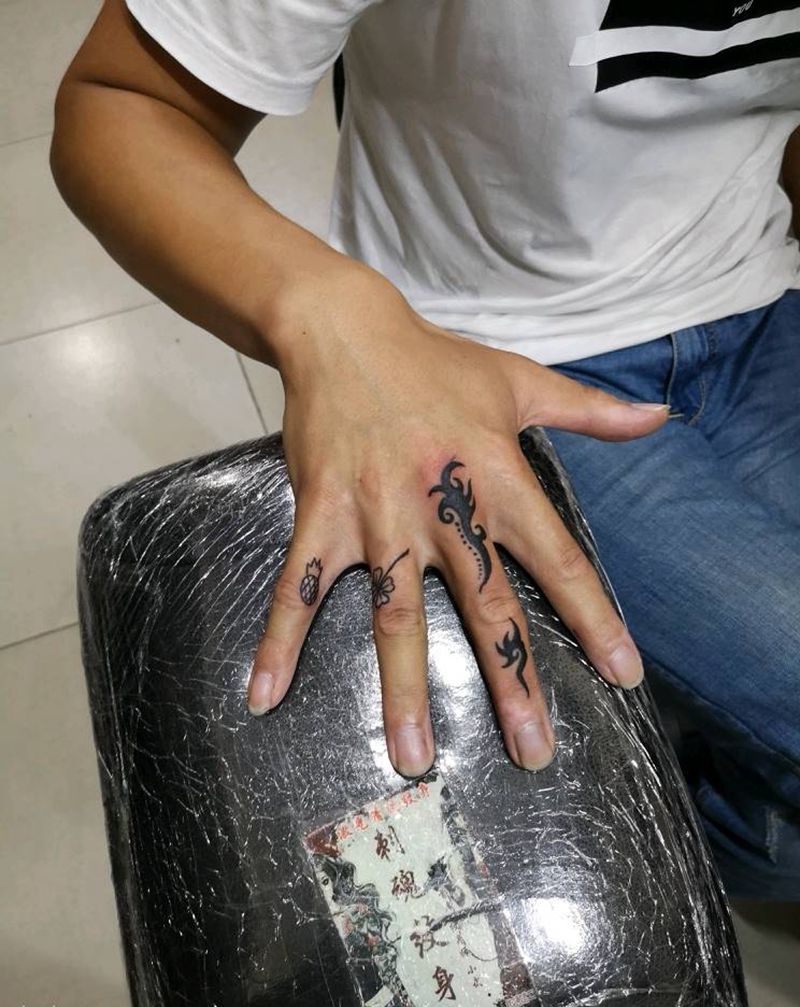 手指遮盖纹身图片_手部图腾纹身图案