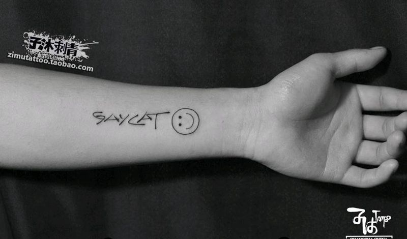 笑脸相迎纹身图片