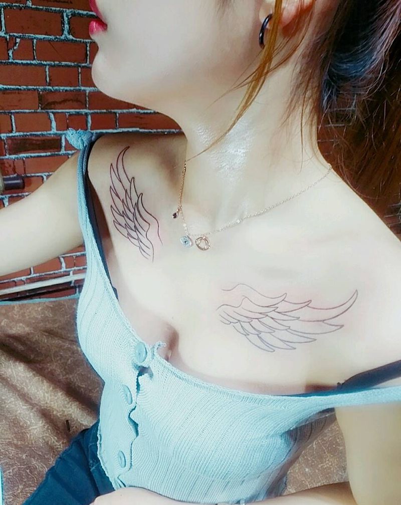 翅膀线条纹身图片_胸部纹身图案