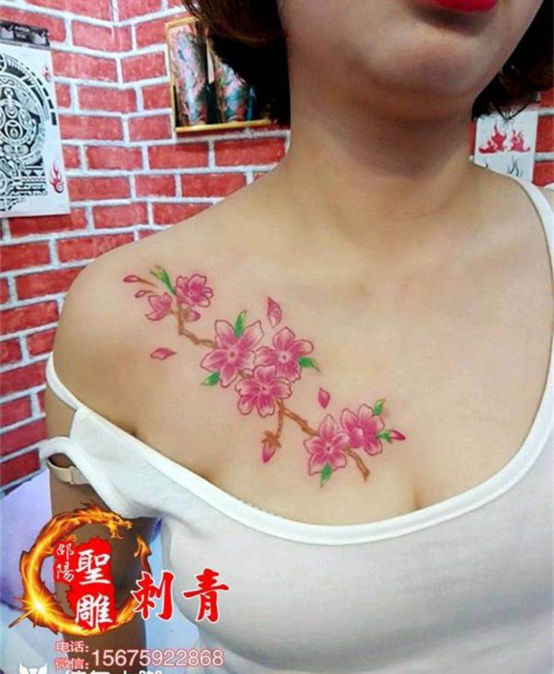 女神.唯美樱花纹身图片_胸部植物成品纹身图案