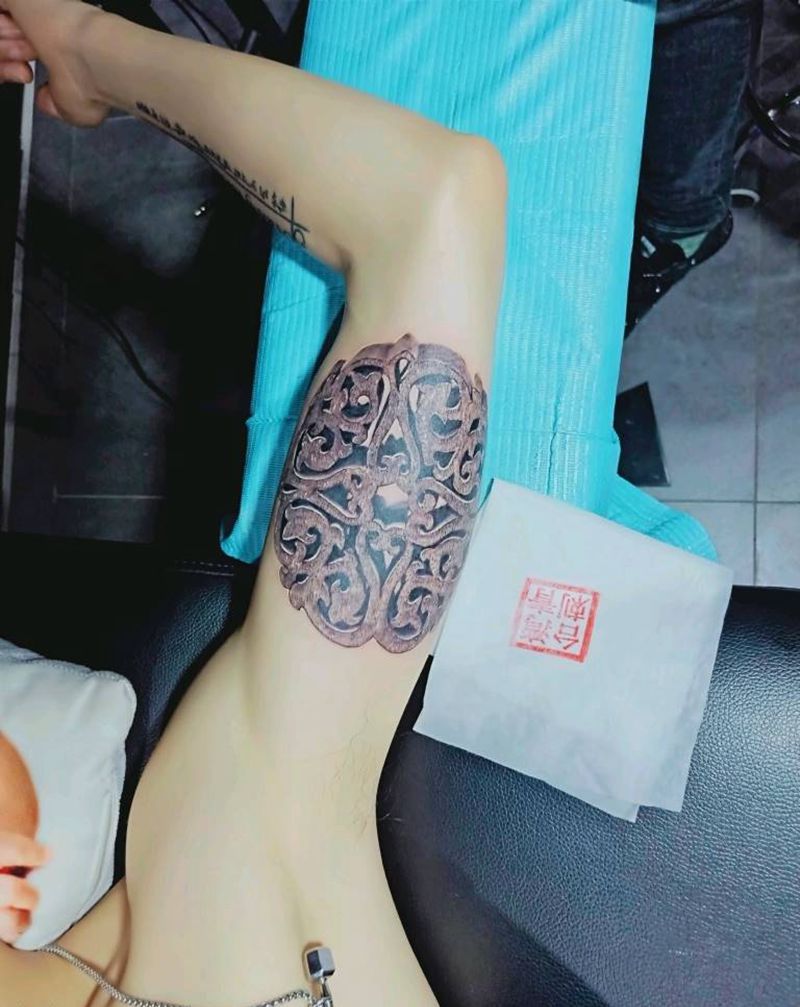 木雕窗花纹身图片_手臂纹身图案