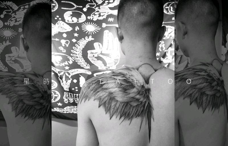 左半边翅膀纹身图片