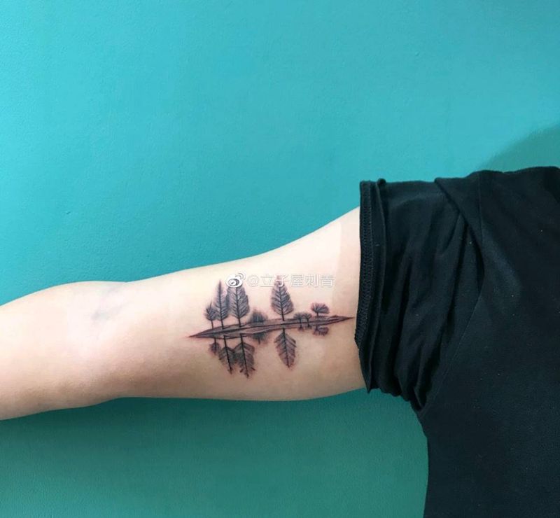 倒影纹身图片_手臂纹身图案