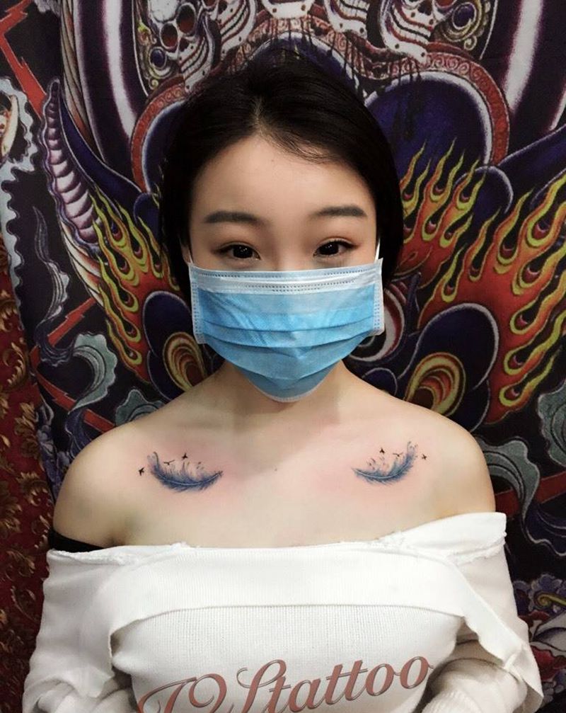 羽毛纹身图片_颈部纹身图案