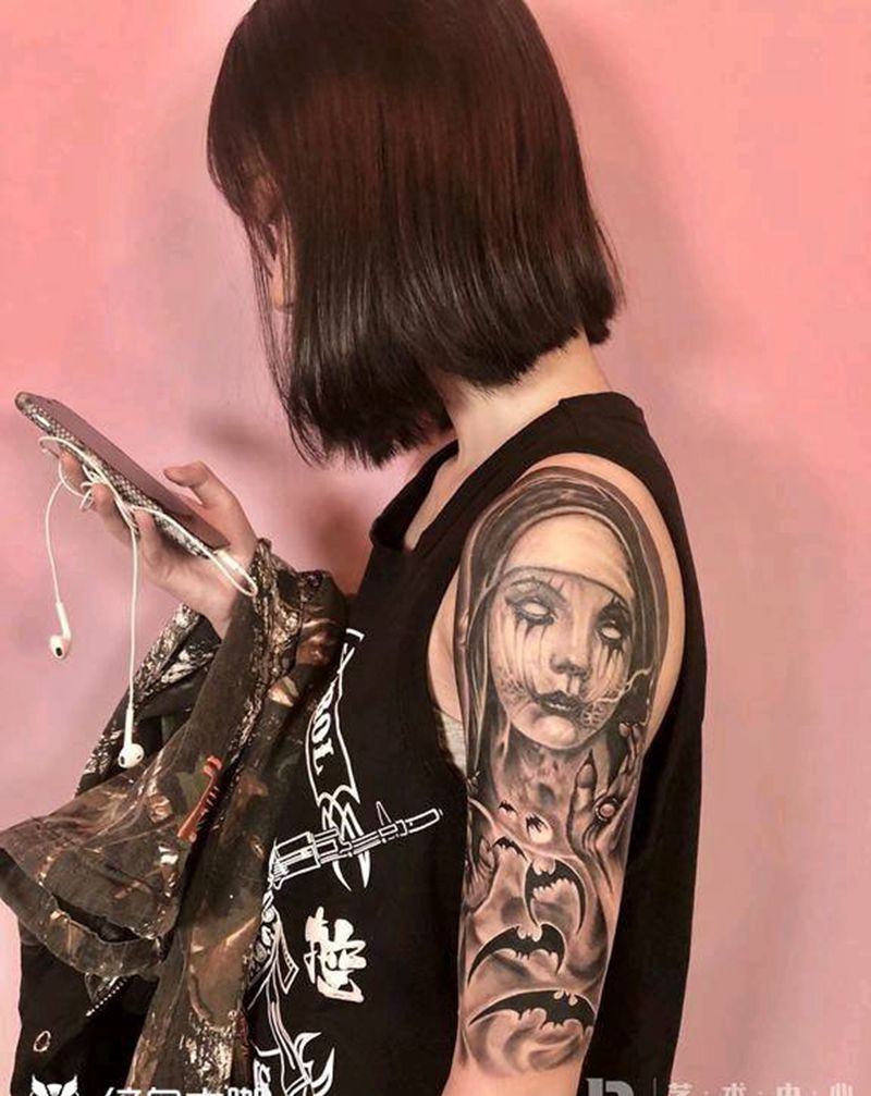 邪恶又个性纹身图片_手臂欧美写实纹身图案