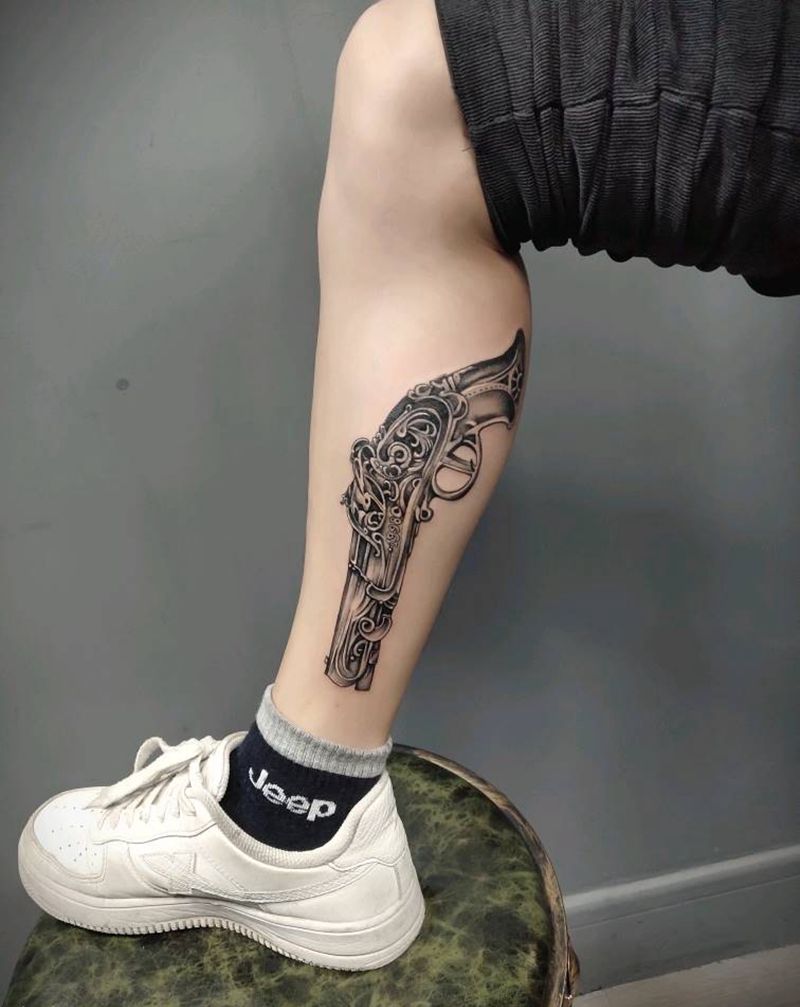枪纹身图片_腿部纹身图案